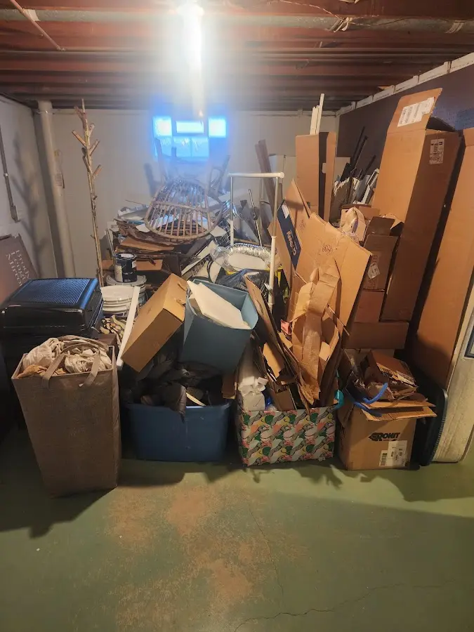 Roll-off dumpster container at job site for 2 Yard Dumpster Rental in McPherson